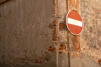 Close-up of do not enter sign on wall