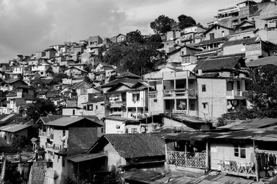 Houses in town against sky