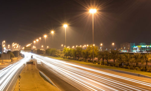 Light trails on city street at night