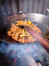 High angle view of meat on barbecue grill