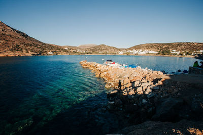 Scenic view of sea against clear blue sky