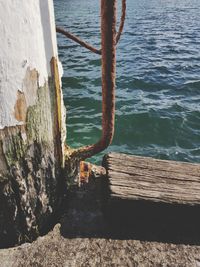 Close-up of pier on sea