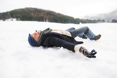 Senior man making a snow angel