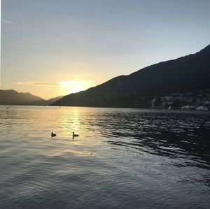 Scenic view of lake against sky during sunset