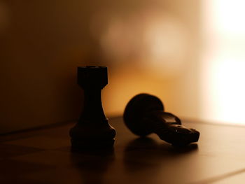 Close-up of chess pieces on table