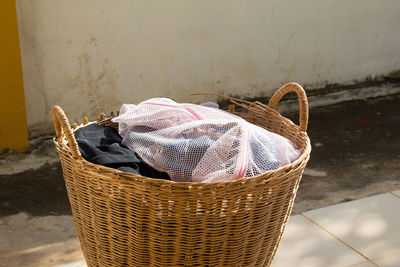 Close-up of clothes in wicker basket outdoors