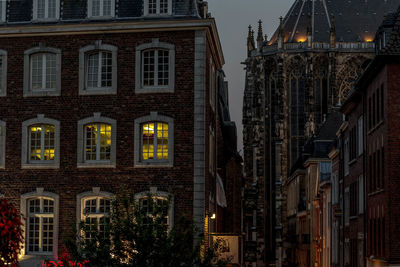 Illuminated city against sky at night