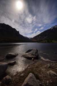 Scenic view of lake against sky at night