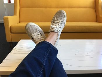 Low section of person in living room at home