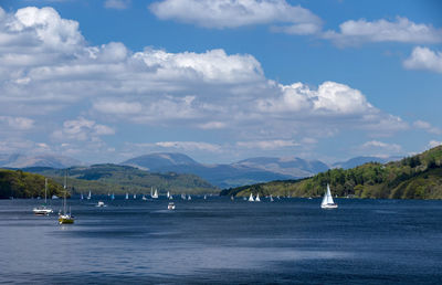 Sailboat on sea against sky