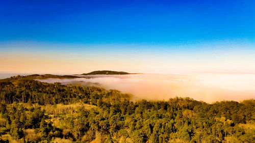 Scenic view of landscape against sky during sunset
