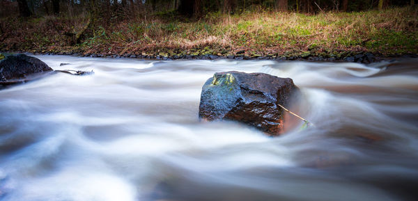 Close-up of water flowing through rocks