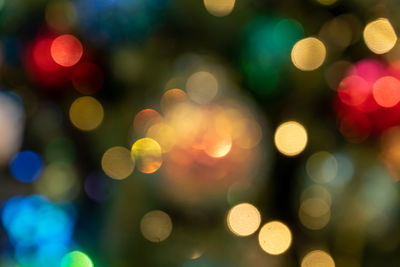 Multicolored glowing bokeh background. abstract bright led light backgdrop. defocused image.