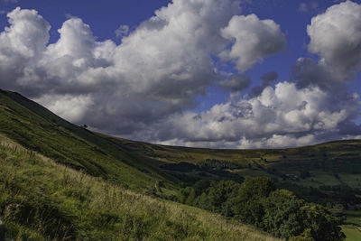 Scenic view of green landscape against sky