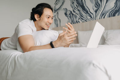 Smiling man talking on video call