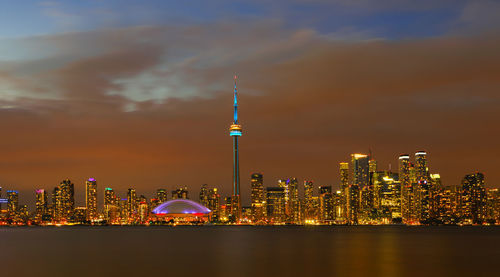 Illuminated buildings in city at night