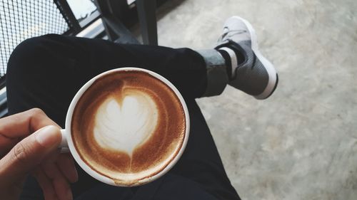 Man holding coffee cup