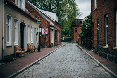 Alley amidst buildings in city