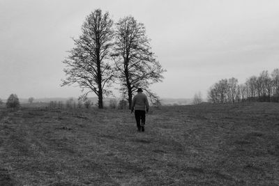 Man on field against sky