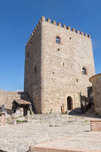 Low angle view of old ruins against clear sky