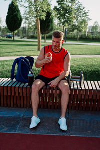 Portrait of man sitting on bench