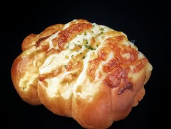 Close-up of bread against black background