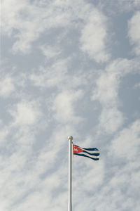 Low angle view of flag against sky