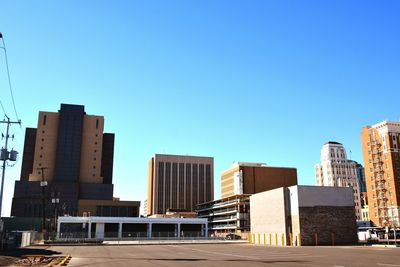 View of buildings against blue sky