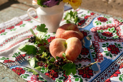 Cropped hand of woman holding food on table