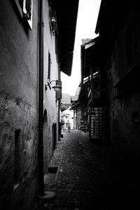 Narrow alley amidst buildings in city