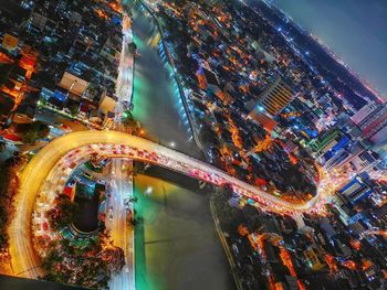 High angle view of illuminated city buildings at night