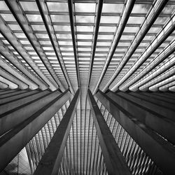 Low angle view of ceiling and columns at railroad station