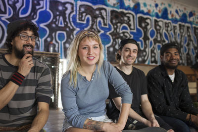 Group of young adults at skating rink.