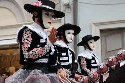 Group of people holding mask