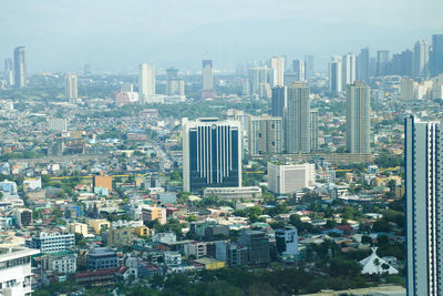 High angle view of buildings in city against sky