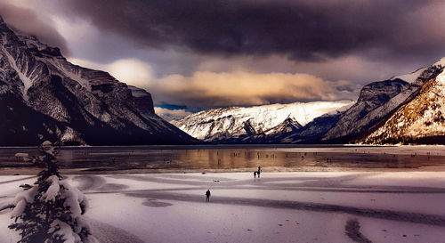 Scenic view of snowcapped mountains against sky during winter