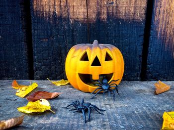 Yellow pumpkin on table during autumn