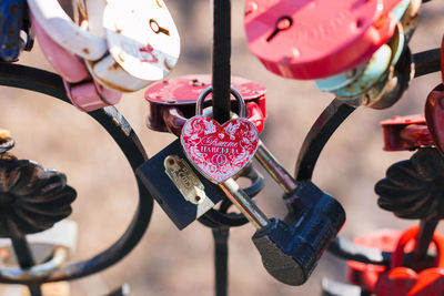 Close-up of padlocks hanging on heart shape