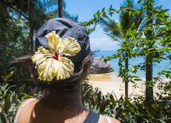 Woman exploring empty beach on the tropical island of ilha grande