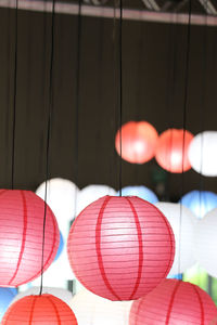 Close-up of illuminated lanterns hanging on ceiling