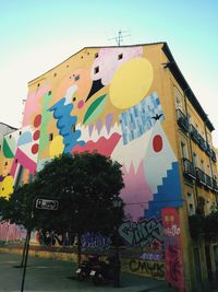 Low angle view of multi colored building against sky