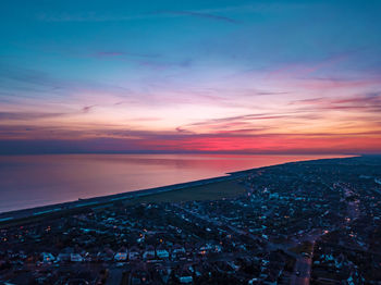 High angle view of beach against sky during sunset