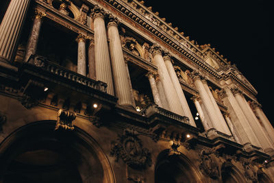 Low angle view of illuminated building at night