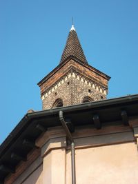 Low angle view of building against clear blue sky