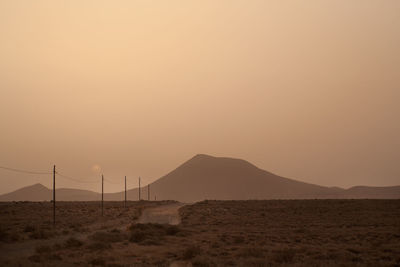 Scenic view of desert against clear sky