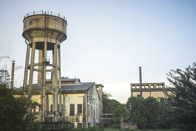 Low view of the old factory against the sky