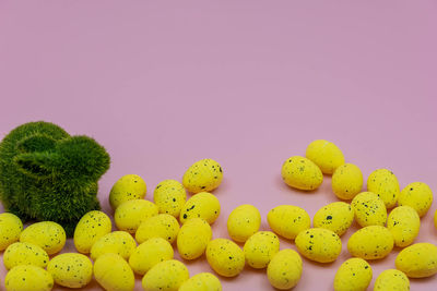 Full frame shot of yellow fruit against white background