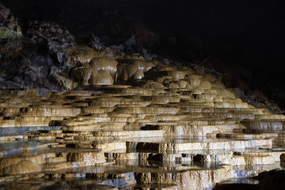 Low angle view of illuminated cave