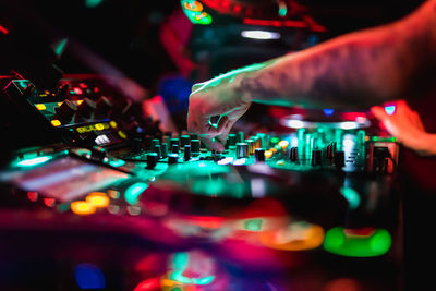 Midsection of man using smart phone at music concert