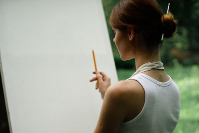 Portrait of woman holding hands